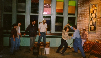 Ben Myers as Lenny beats up Tony Massarello as Curley in "Of Mice and Men," 1998
